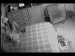 While viewing porn on TV, the wife was caught masturbating on a concealed camera.
